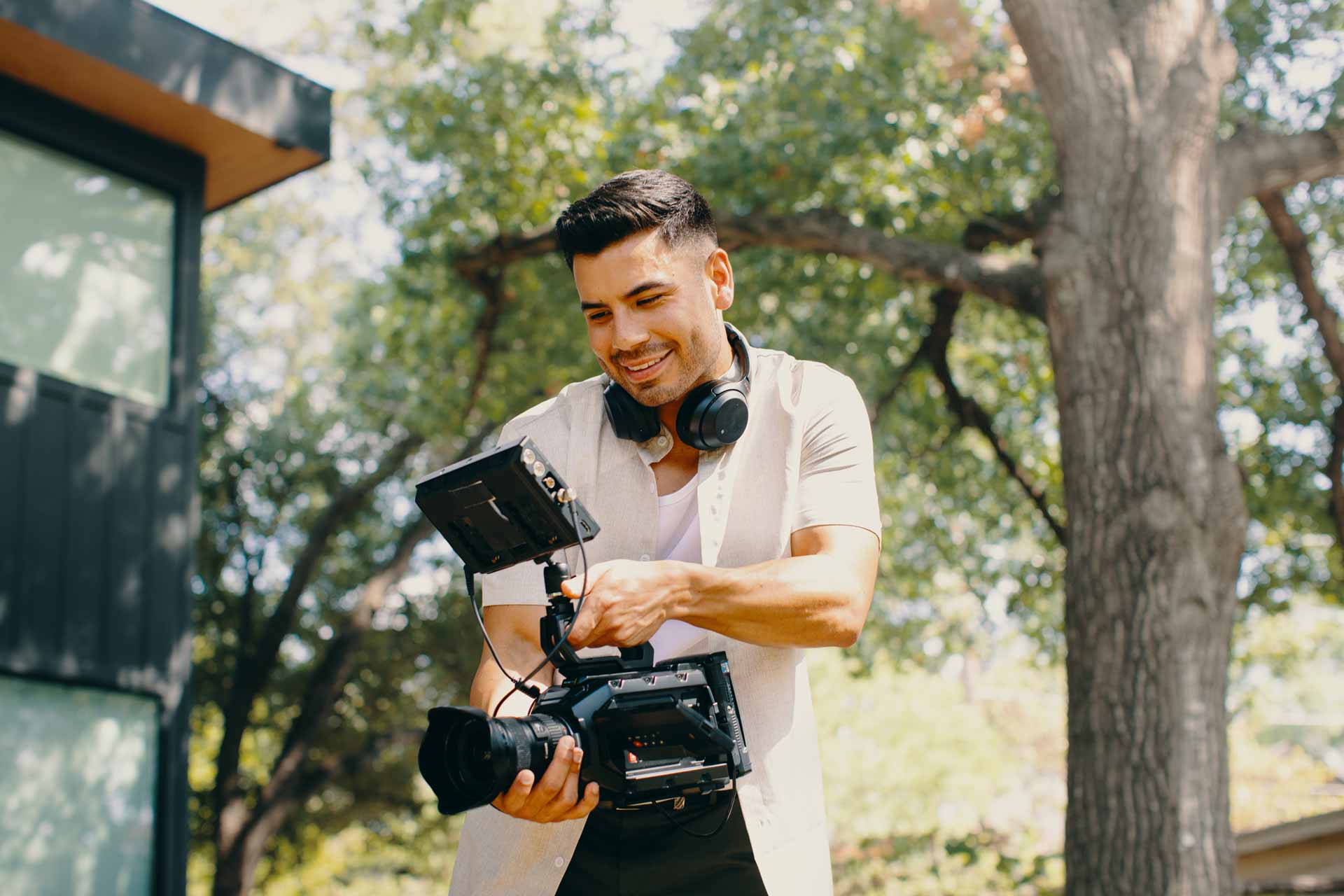 Lifestyle production still of a videographer for Contentful