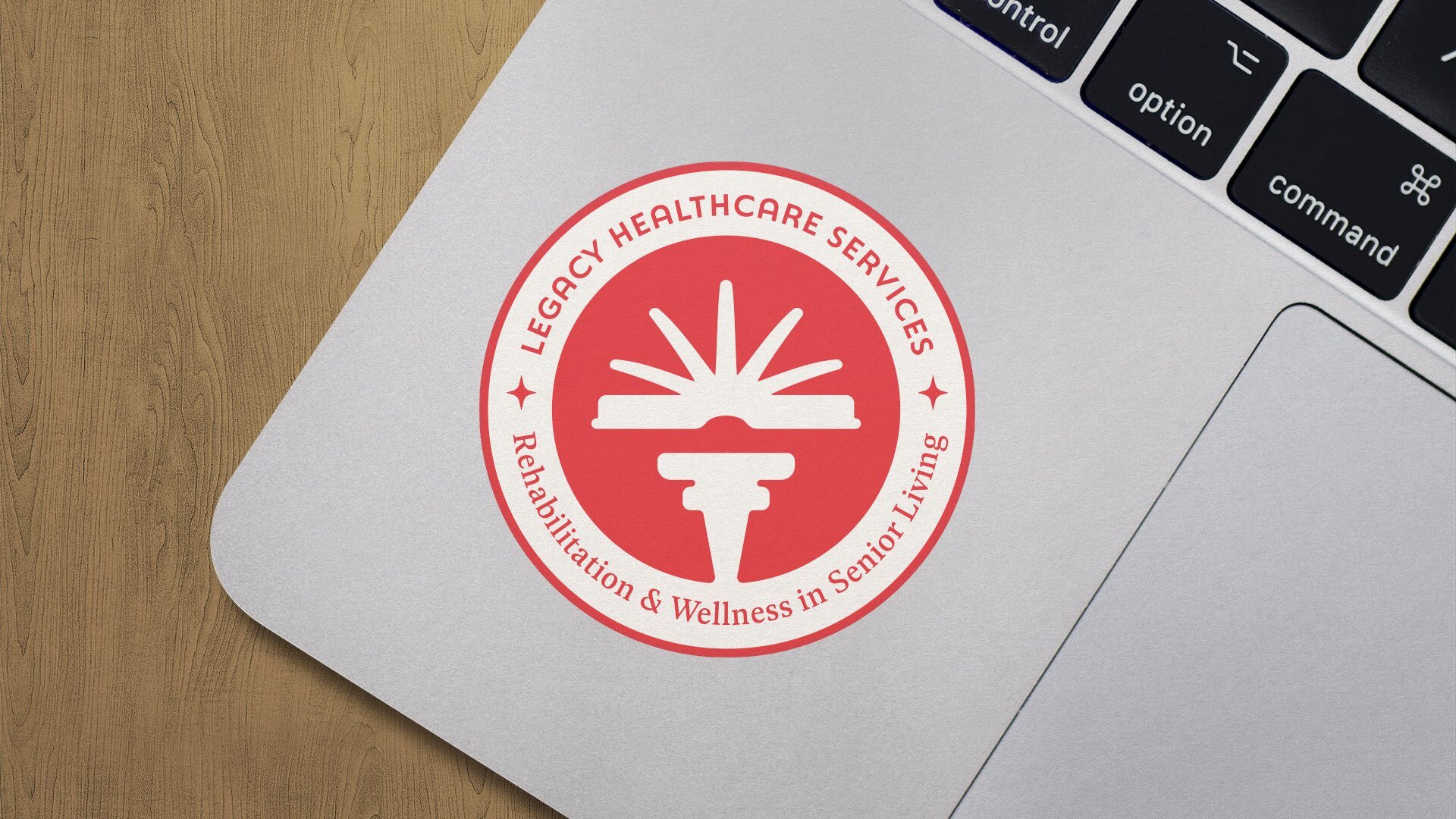 Legacy Healthcare Services rebrand logo design applied to a laptop sticker