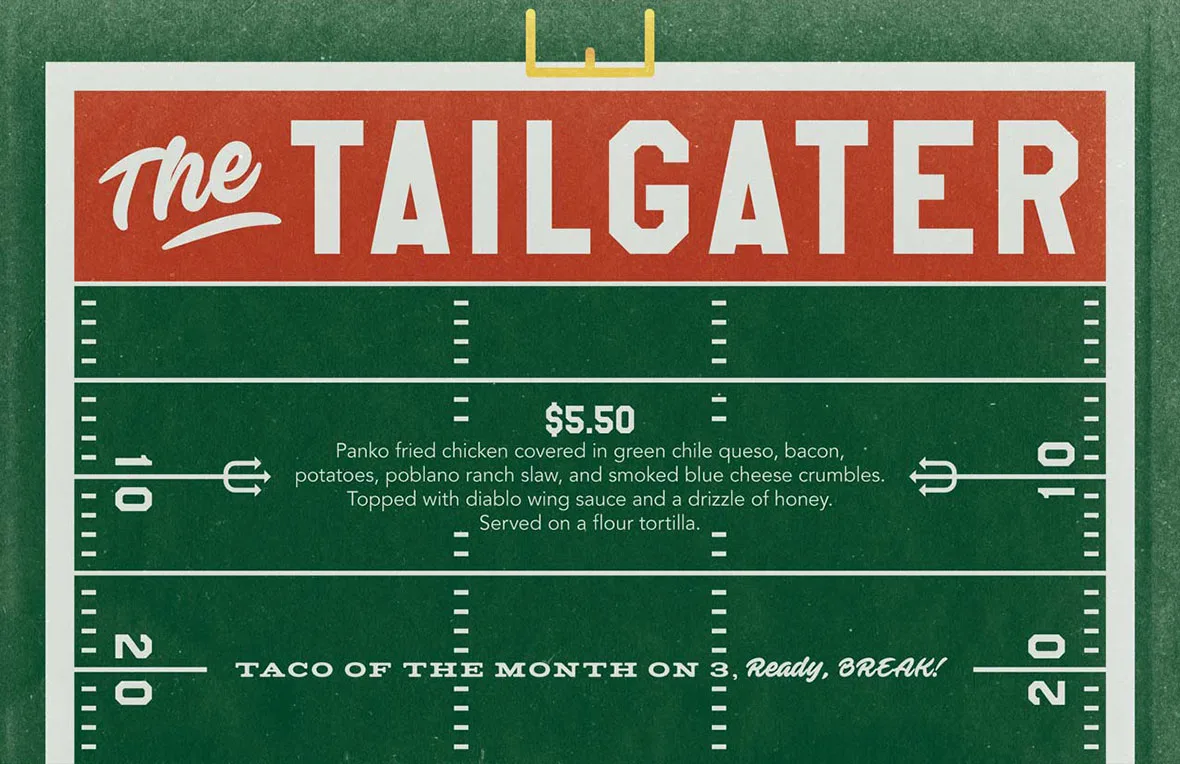 Football themed torchy's taco of the month graphic, promoting The Tailgater: Panko fried chicken covered in green chile queso, bacon, potatoes, poblano ranch slaw, and smoked blue cheese crumbles. Topped with diablo wing sauce and a drizzle of honey. Served on a flour tortilla.