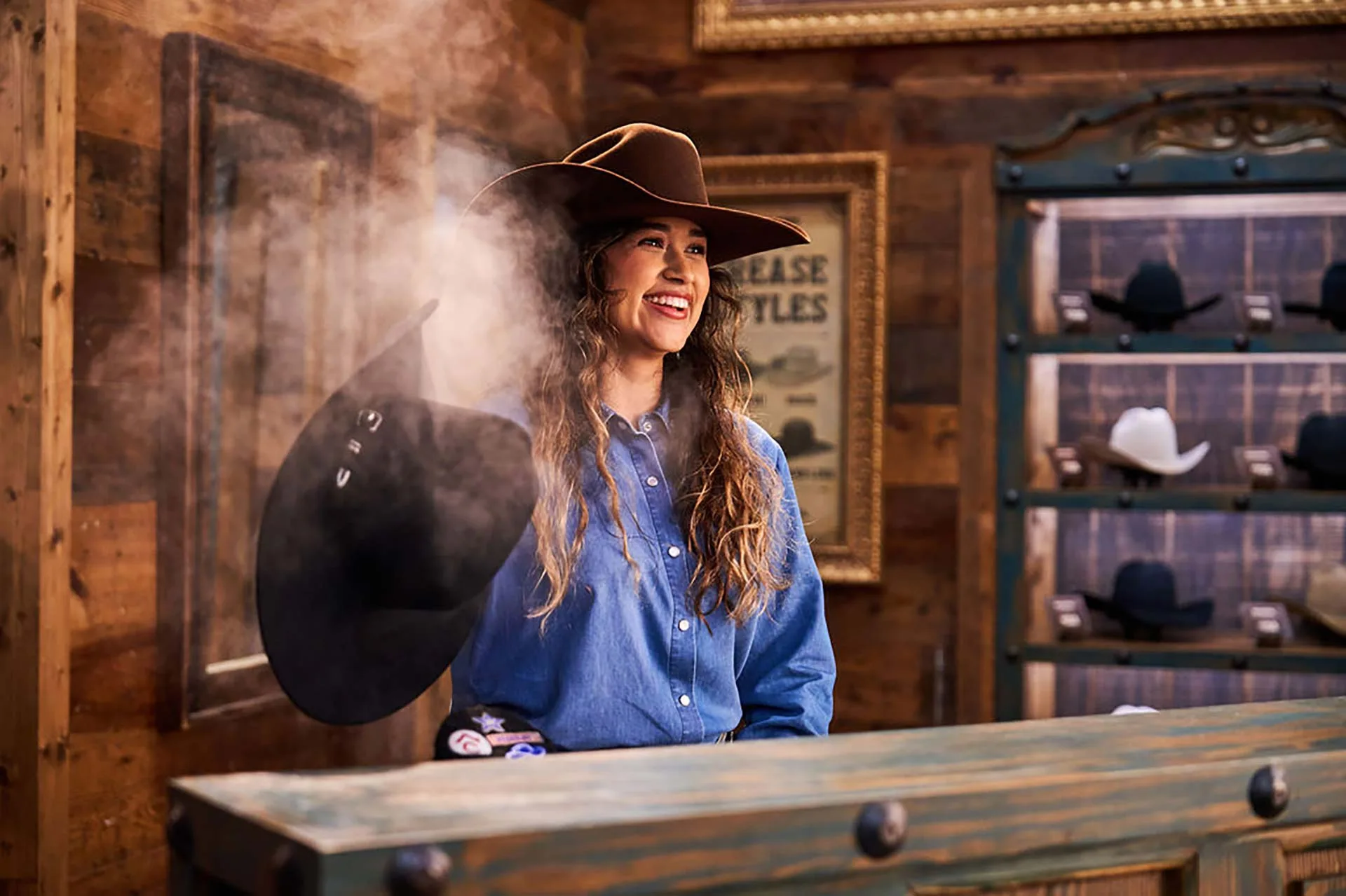 Woman hat shaping with steam inside Cavender's