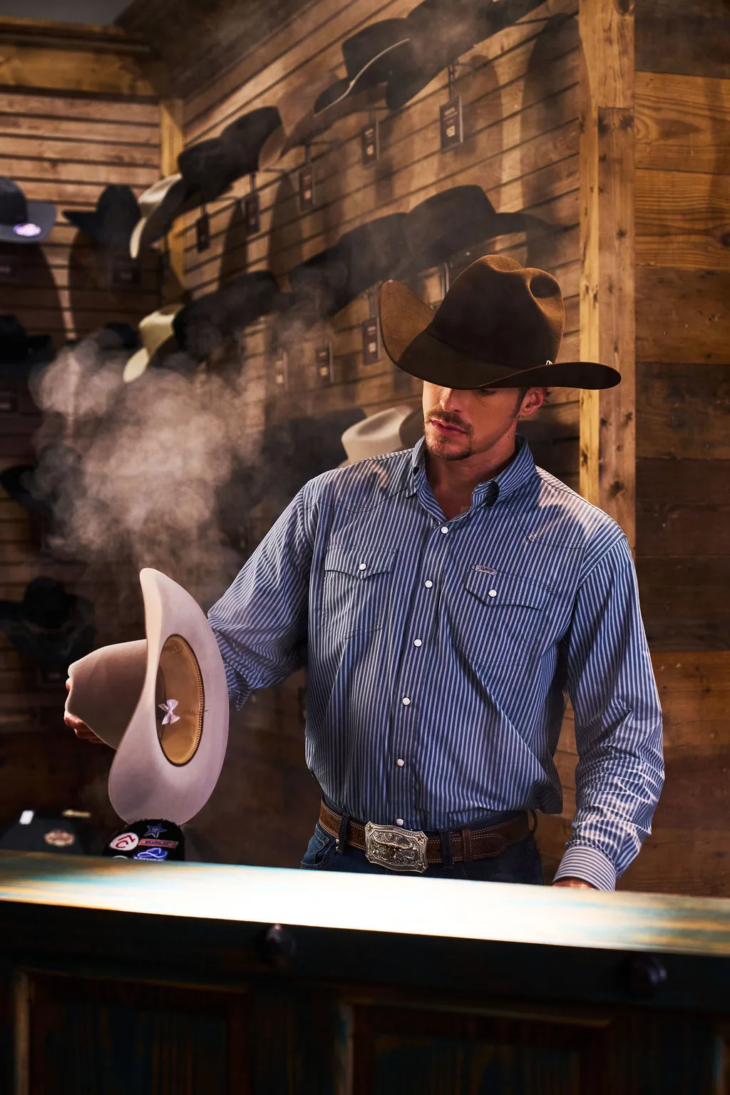 Man in Cavender's location shaping hats